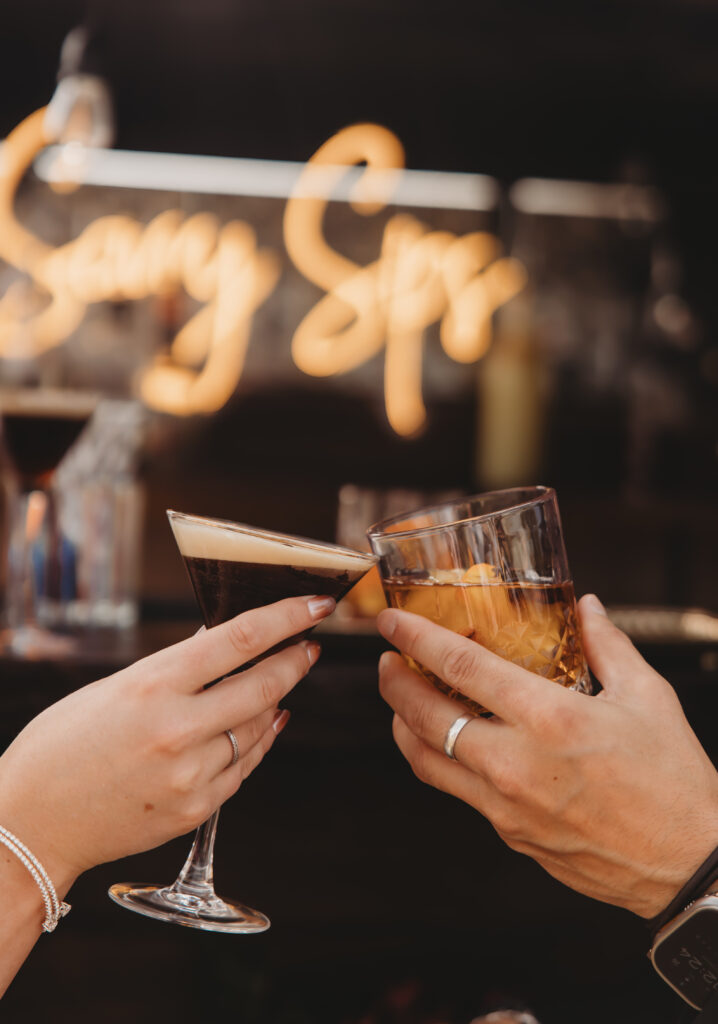 Cheers with an espresso martini and cocktail at a Colorado event featuring Savvy Sips mobile bar service